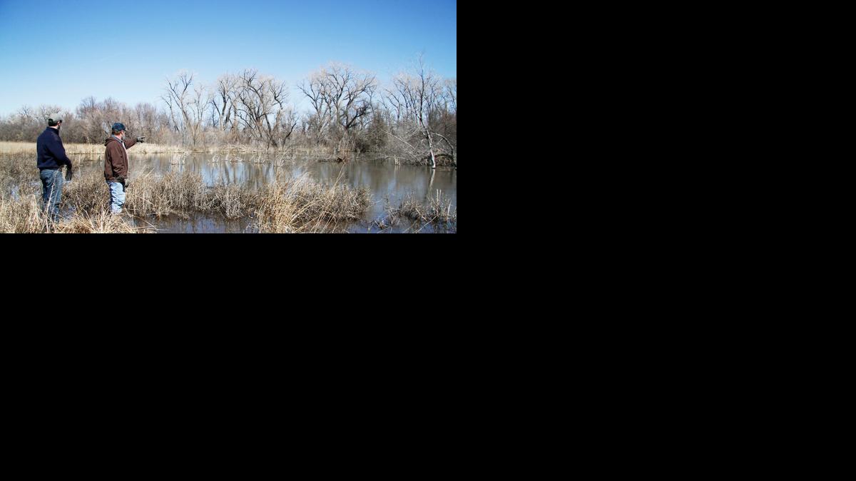 Bill Johnson, right, has been working to get a conservation easement put on his property so a favored wetlands could never be drained and the land developed. A current bill could greatly hamper conservation easements in Kansas.

