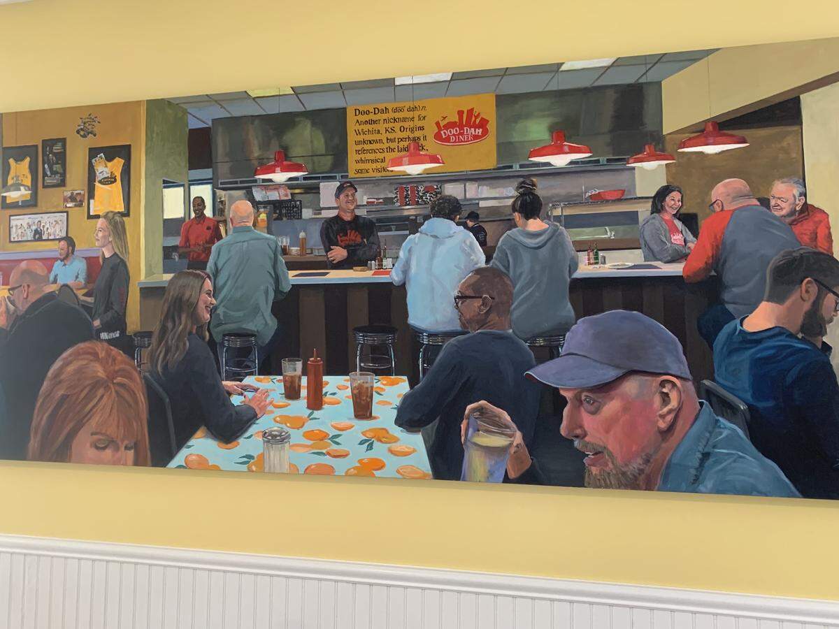 Wichita painter Richard Davies was commissioned to paint the original Doo-Dah Diner as it was, and his piece now hangs on the wall of the newly remodeled restaurant.