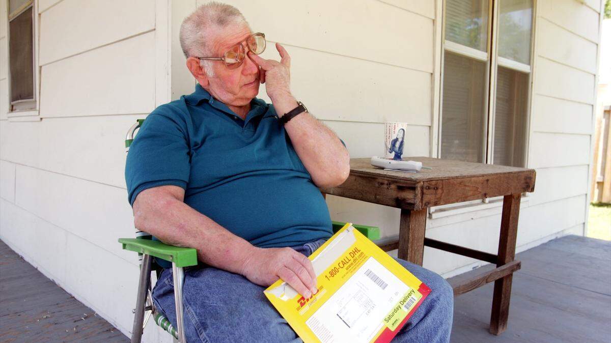 Johnnie Jones, of Wichita, is overcome with emotion after receiving a letter Saturday morning informing him that his employment at Boeing has been terminated after 32 years as an assembler. PHOTO BY RANDY TOBIAS, The Wichita Eagle.