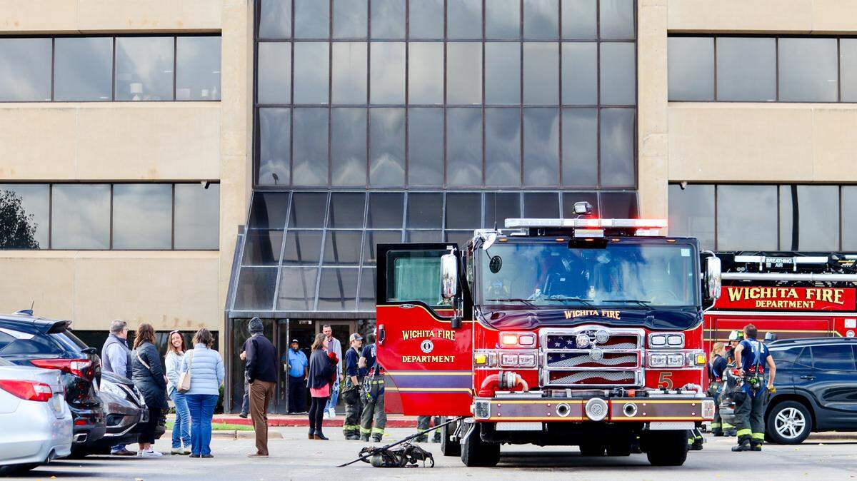 Members of the Wichita Fire Department respond to an electrical fire at River Park Place on Tuesday afternoon.