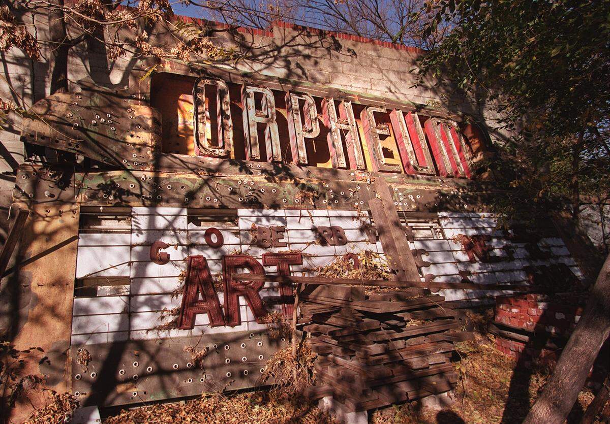 The old Orpheum marquee was photographed in 2002 sitting in a junkyard at Central and Washington.