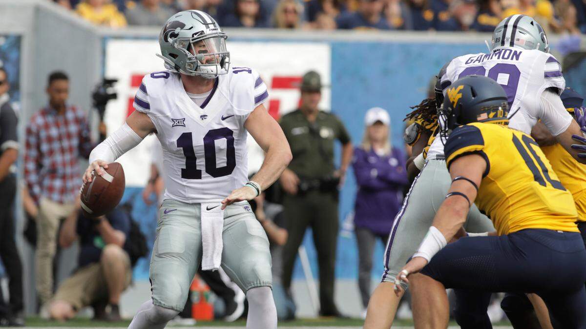 Kansas State quarterback Skylar Thompson attempts a pass against West Virginia. (AP Photo/Raymond Thompson)