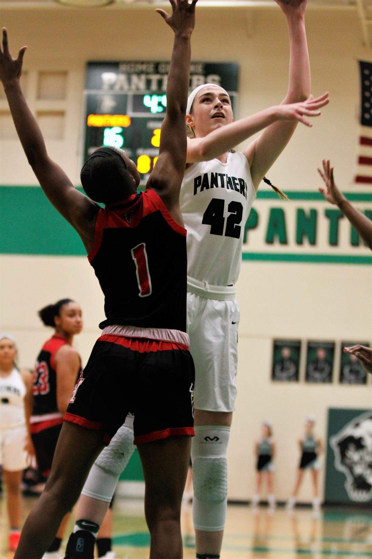 Derby senior center Kennedy Brown elevates for a hook shot against Wichita Heights’ Laniah Randle during the Panthers’ 66-52 win over Wichita Heights on day one of the AVCTL/GWAL Challenge. (Jan. 10, 2019)