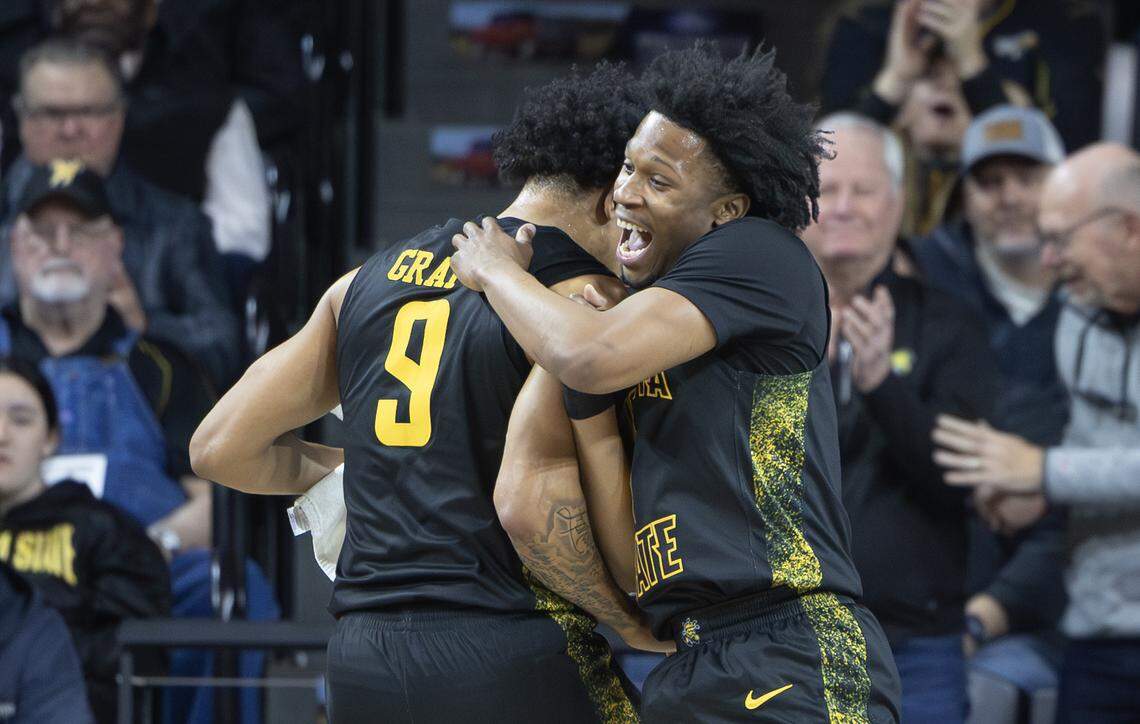 Wichita State’s Michael Gray Jr., and Kenyon Giles celebrate a first half scoring run against East Carolina on Wednesday night at Koch Arena.