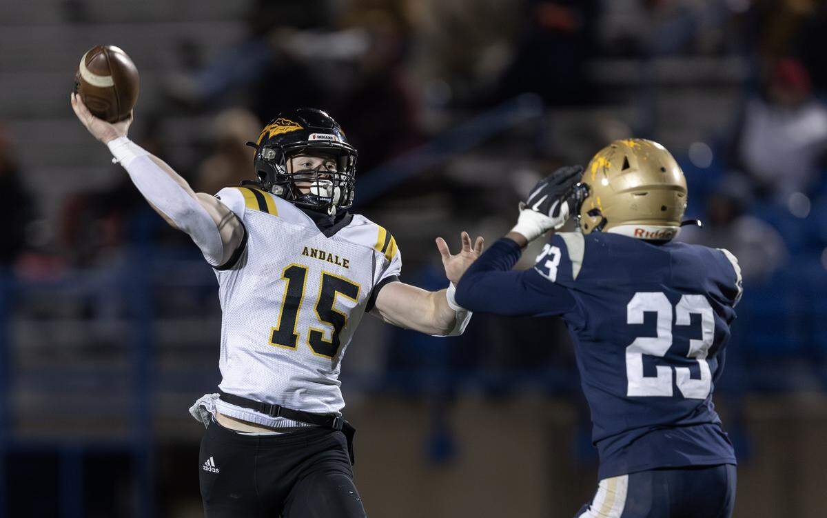 Andale quarterback Samuel Harp gets off a pass that led to a touchdown in the second quarter against Topeka Hayden. The Indians beat Topeka Hayden 38-6 on Friday night in Hutchinson to win the 3A state title.