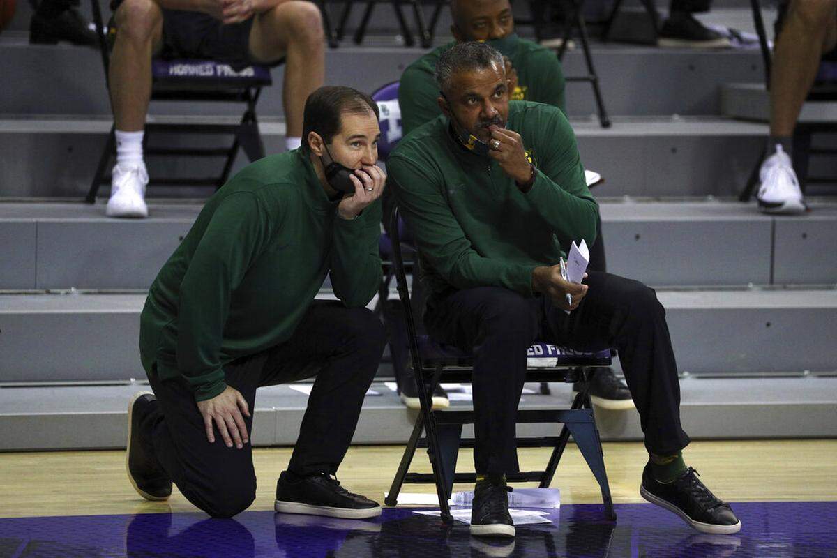 Baylor head coach Scott Drew talks with associate head coach Jerome Tang during a men’s NCAA college basketball game against TCU, Saturday, Jan. 9, 2021. (AP Photo/ Richard W. Rodriguez)