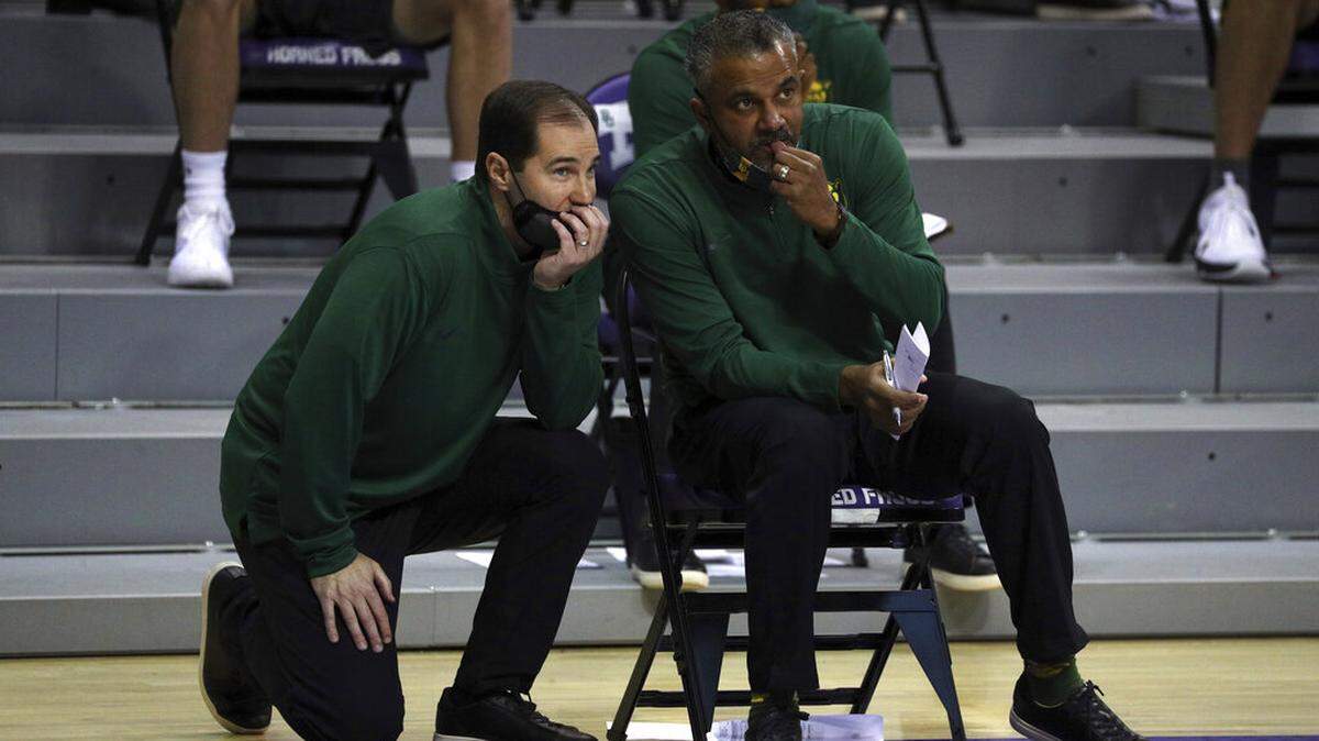 Baylor head coach Scott Drew talks with associate head coach Jerome Tang during a men’s NCAA college basketball game against TCU, Saturday, Jan. 9, 2021. (AP Photo/ Richard W. Rodriguez)