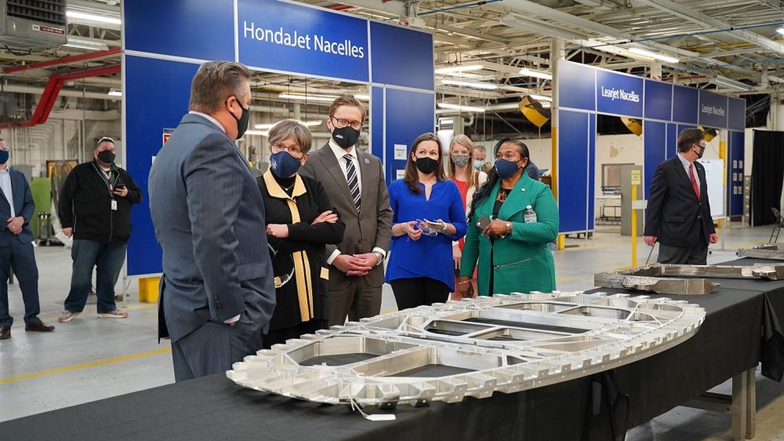 From left: President of HM Dunn Phil Anderson, Gov. Laura Kelly, Lt. Governor David Toland, Senior Director of Customers and Business Development Katie McNatt, Sen. Oletha Faust-Goudeau talk during Kelly’s “Back to Work, Back to School” tour.