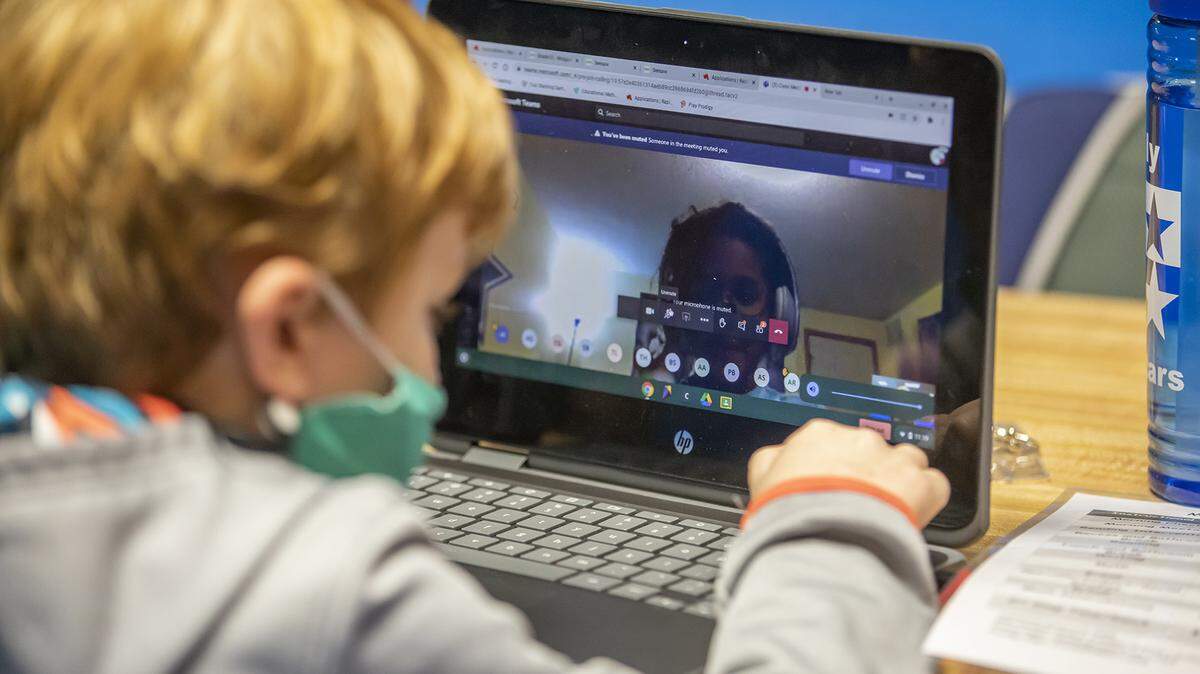 An elementary student attends his remote learning class from Carousel Skate Center in Wichita Tuesday, Dec. 8, 2020. The pandemic made child care difficult for working parents with young children in remote school. As the state reopens and recovers, here’s what you need to know about how to apply for child care assistance in Kansas.