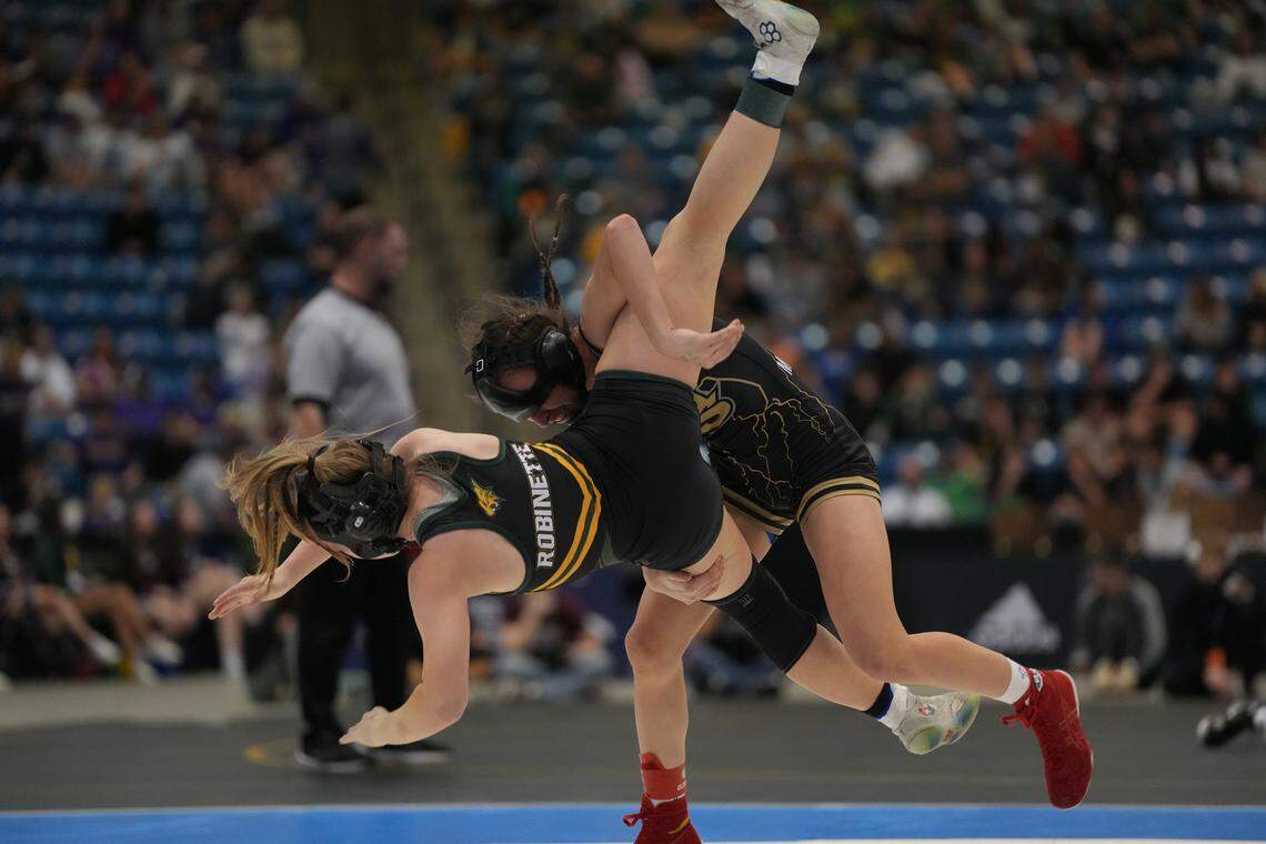 Maize South’s Krislynn Martinez slams Basehor-Linwood’s Lydia Robinette to the matt in the 5A State Championship wrestling tournament.