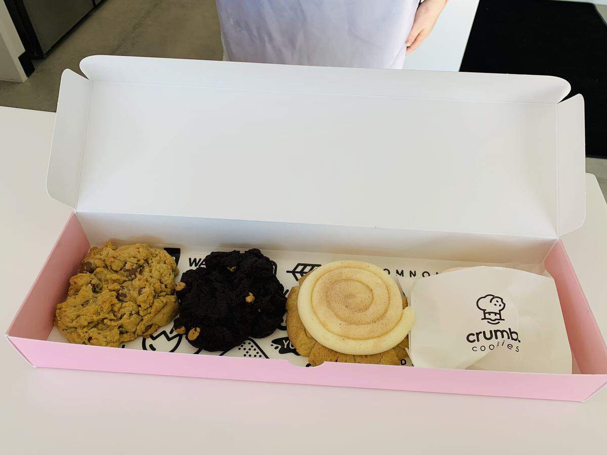 Crumble Cookies are served in a signature pink box.