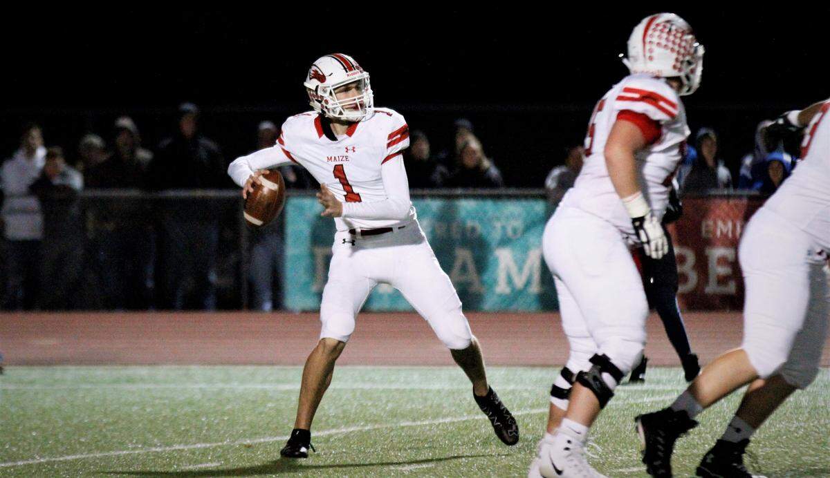 Maize senior quarterback Caleb Grill readies to fire downfield during the Eagles’ state semifinal against Wichita Northwest on Friday. (Nov. 16, 2018)