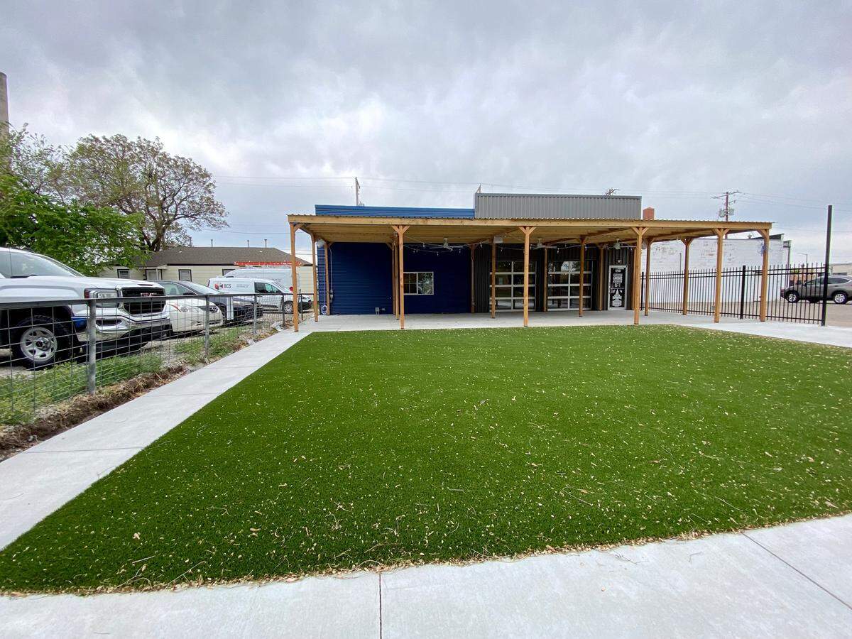 The turf area and covered patio in front of the about-to-open new Hopping Gnome tap room have more than twice the square footage of the current tap room on Douglas.