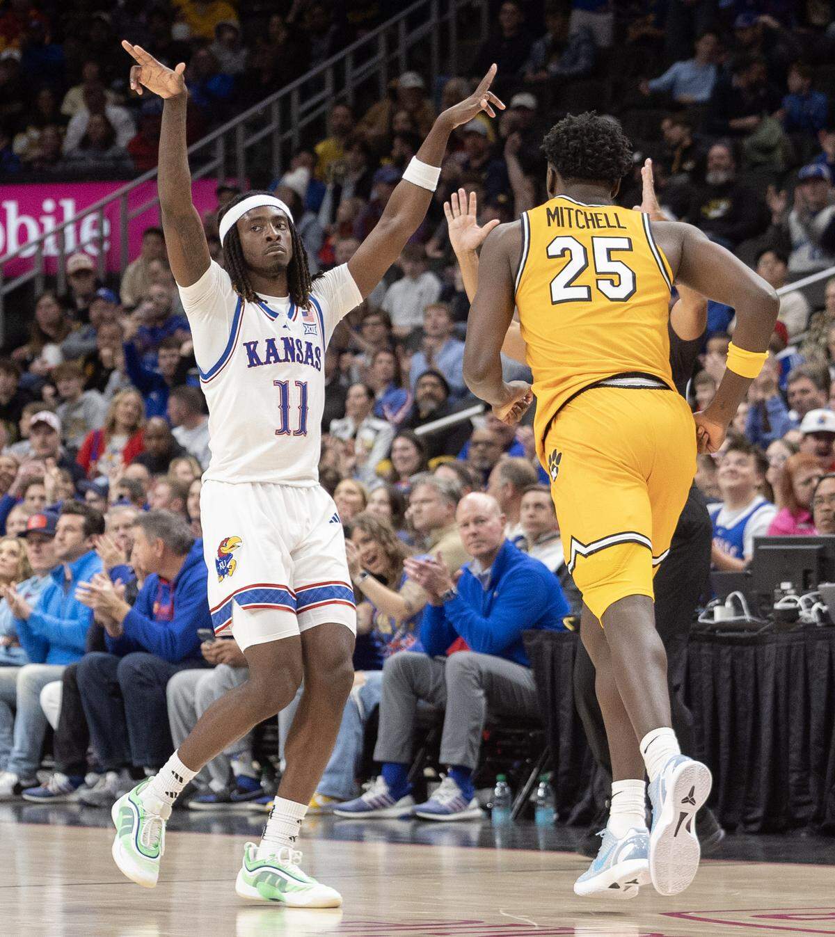 Kansas’ Jamari McDowell celebrates a three pointer inform of Missouri’s Mark Mitchell during the second half of their game the T-Mobile Center on Sunday.