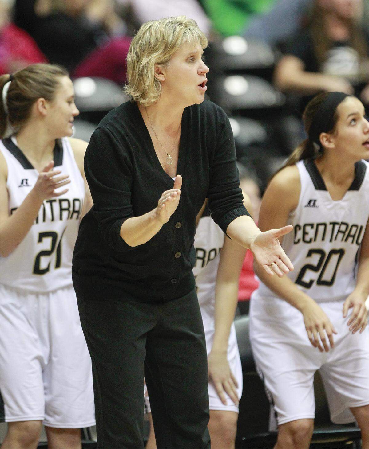 Andover Central coach Stana Jefferson cheers her team on during their game with Heights during the City League vs AVCTL Basketball Challenge at Koch Arena Friday. (Jan. 3, 2014)