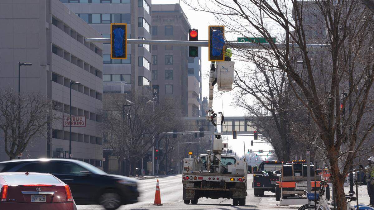 Work is done on the traffic lights at Second and Main.