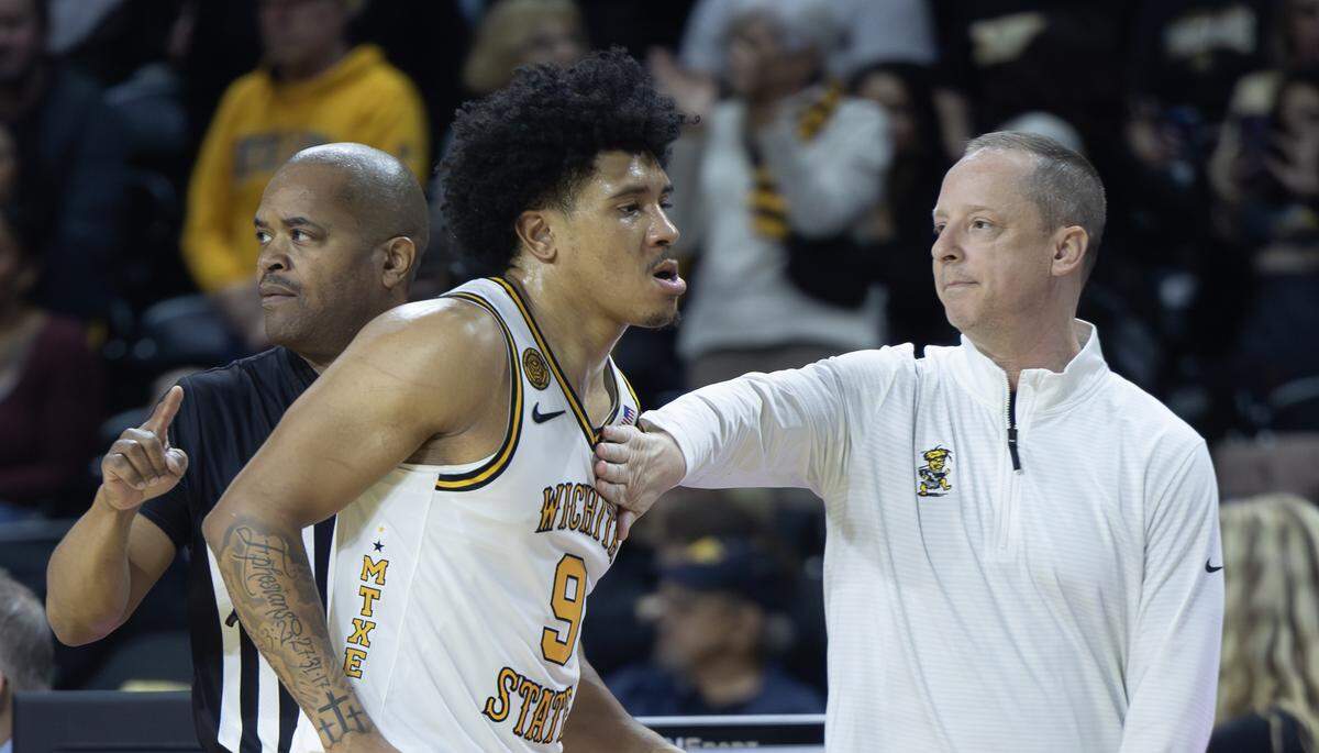 Wichita State coach Paul Mills congratulates Michael Gray Jr. late in the game against Loyola at Koch Arena on Thursday.