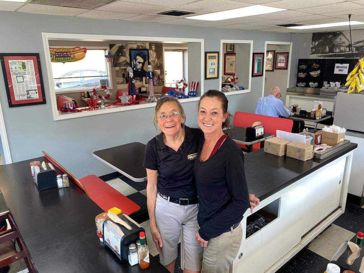 Betty Gettings, left, has worked at NuWay since 1977. She’s pictured here with longtime manager Angel Ouellete at the original store at 1416 W. Douglas.