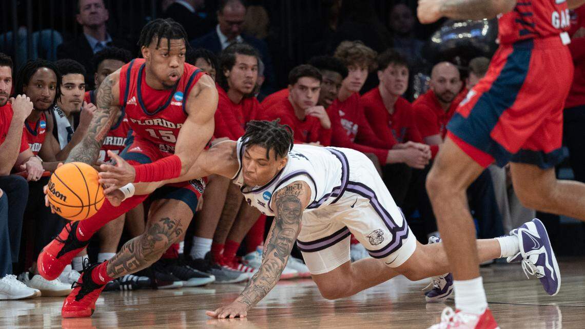 Kansas State’s Keyontae Johnson (on floor) was called for a foul while trying to come up with a loose ball against Florida Atlantic’s Alijah Martin during the second half of their East Region final game at Madison Square Garden on Saturday night, March 25, 2023.