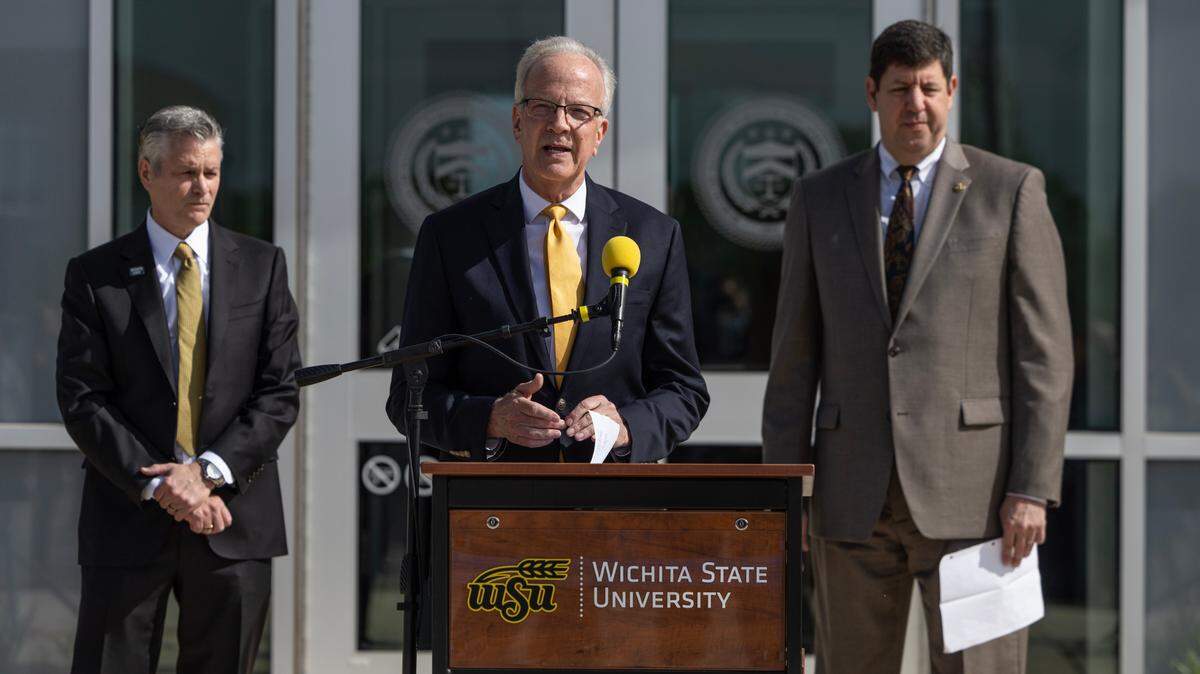 U.S. Senator Jerry Moran, middle, speaks during a ribbon cutting ceremony for the new Bureau of Alcohol, Tobacco, Firearms and Explosives National Crime Gun Intelligence Center of Excellence at Wichita State University on Monday. ATF Director Steven Dettelbach is on the right and Dr. Richard Muma, president of Wichita State University, is on the left.