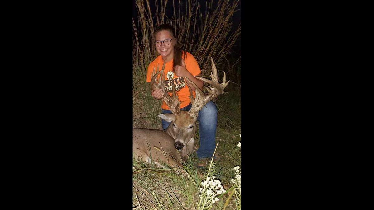 Paslie Werth of Cimarron celebrates after shooting her record 2020 buck in Kiowa County. Her family had been watching the deer grow for three years.