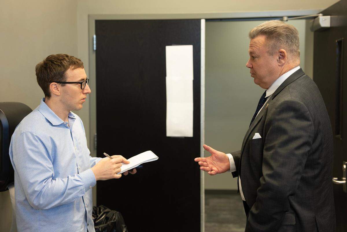 Wichita Eagle reporter Michael Stavola, left, interviews Wichita Chief of Police Joe Sullivan. Stavola recently won the News Leaders Association award for accountability journalism for a series of stories he wrote about the Wichita Police Department’s text messaging scandal, which started before Sullivan was at the department but continues to have ramifications.
