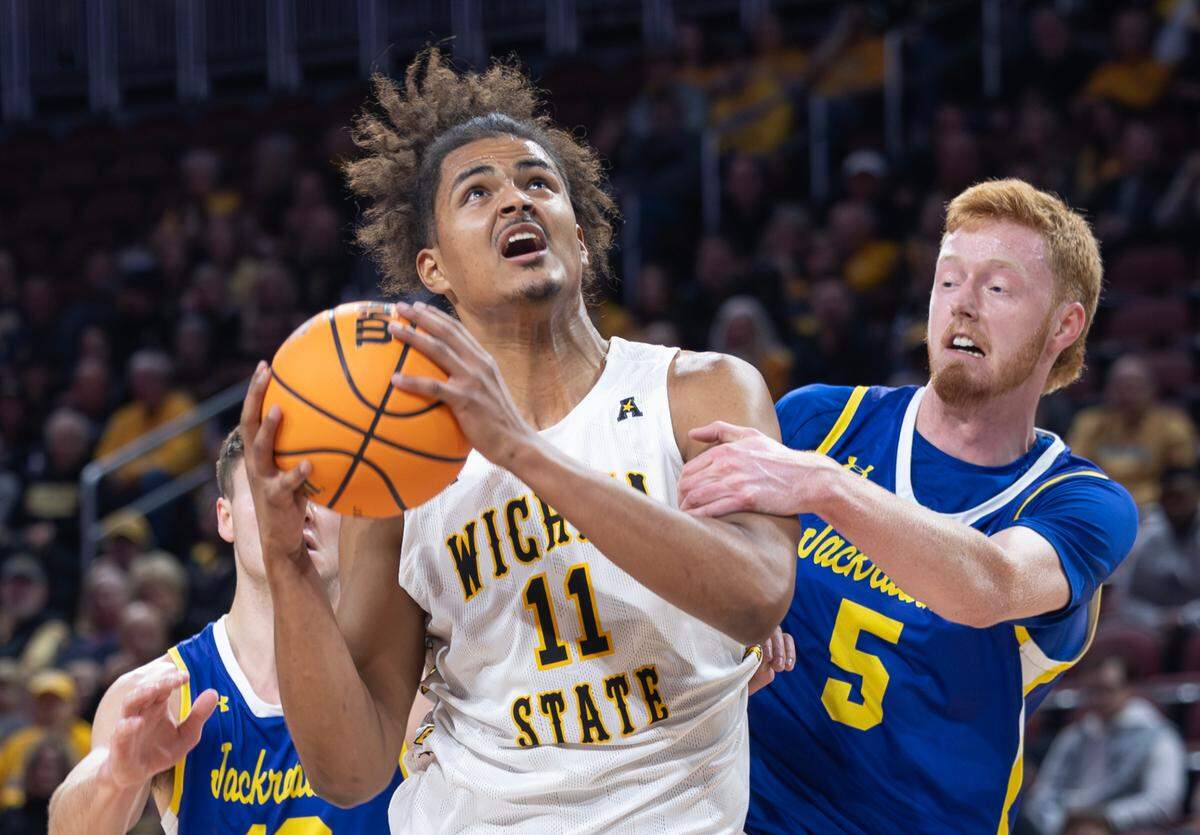Wichita State’s Kenny Pohto is fouled by South Dakota State’s Nate Barnhart during the first half of their game at Intrust Bank Arena on Saturday evening, Dec. 9, 2023.
