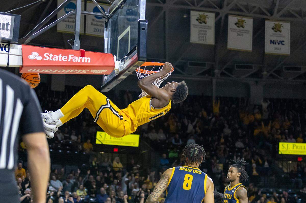 Quincy Ballard dunks the ball in Wichita State’s win over East Tennessee State at Koch Arena on Saturday.