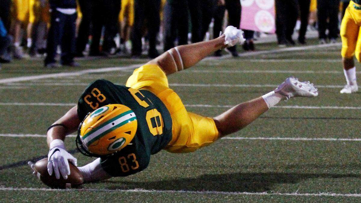 Bishop Carroll senior tight end Clay Cundiff lays out for a touchdown in the Golden Eagles’ 24-6 loss to Derby on Friday night. (Sept. 21, 2018)