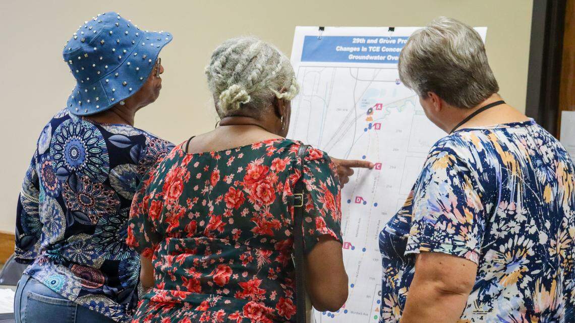 Mary Daily, a geologist with the Kansas Department of Health and Environment helps two women find their houses on a map of the areas affected by the 29th and Grove chemical leak during a recent open house to update residents about remediation efforts.