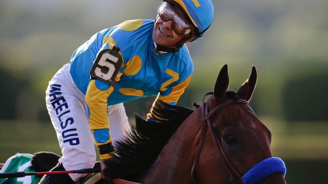Victor Espinoza slows American Pharoah (5) after winning the 147th running of the Belmont Stakes horse race in 2015.