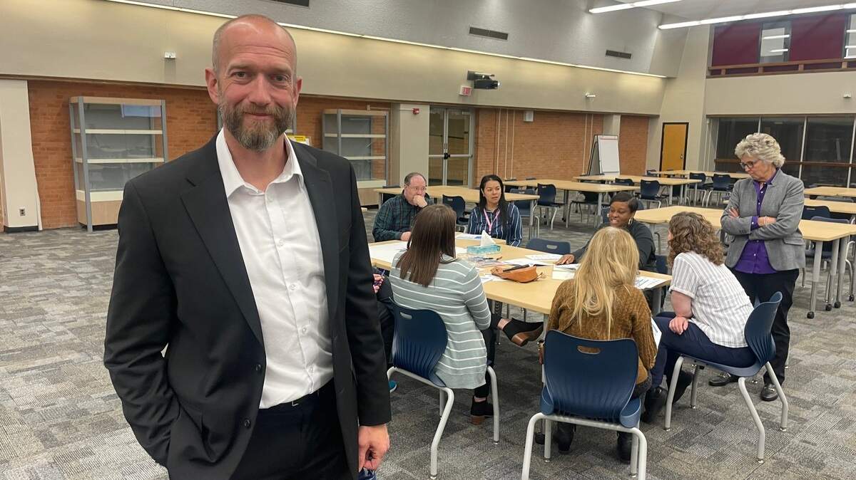 David Sturtz of Woolpert poses at a community meeting where his Ohio-based consulting firm laid out four options for how the Wichita school district could address its deferred maintenance needs over the next 20 years.