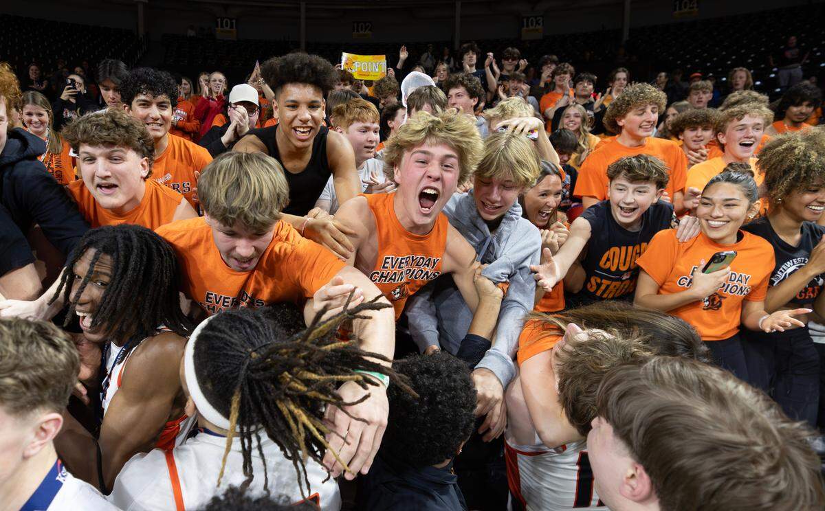 Shawnee Mission Northwest students and players celebrate the team’s win over Olathe North in the 6A Kansas state championship game on Saturday in Wichita.
