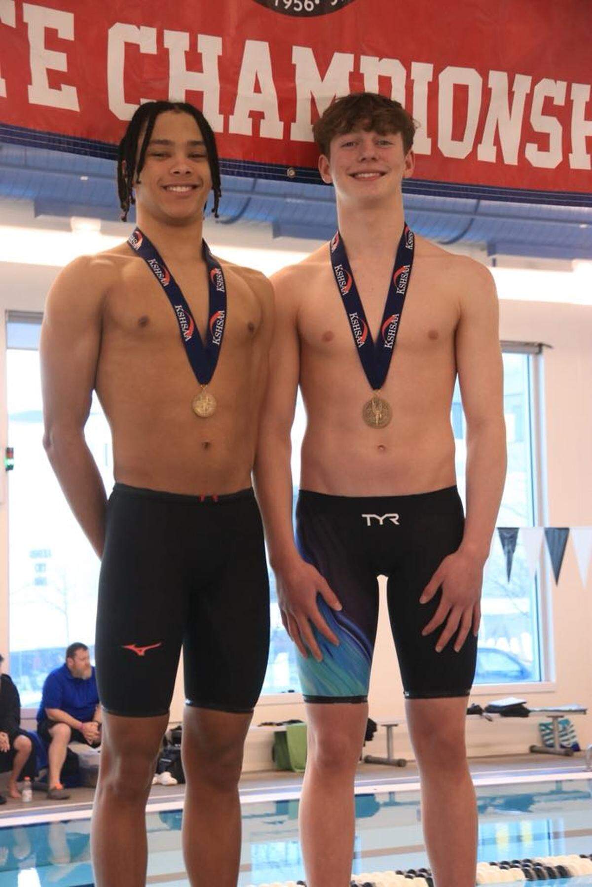 Winfield’s Corden Cuington (left) and Eisenhower’s Dylan Patterson (right) both won gold medals in the 50-yard freestyle after tying with the same winning time in the race. It is the first gold-medal tie at the state meet since 2010.