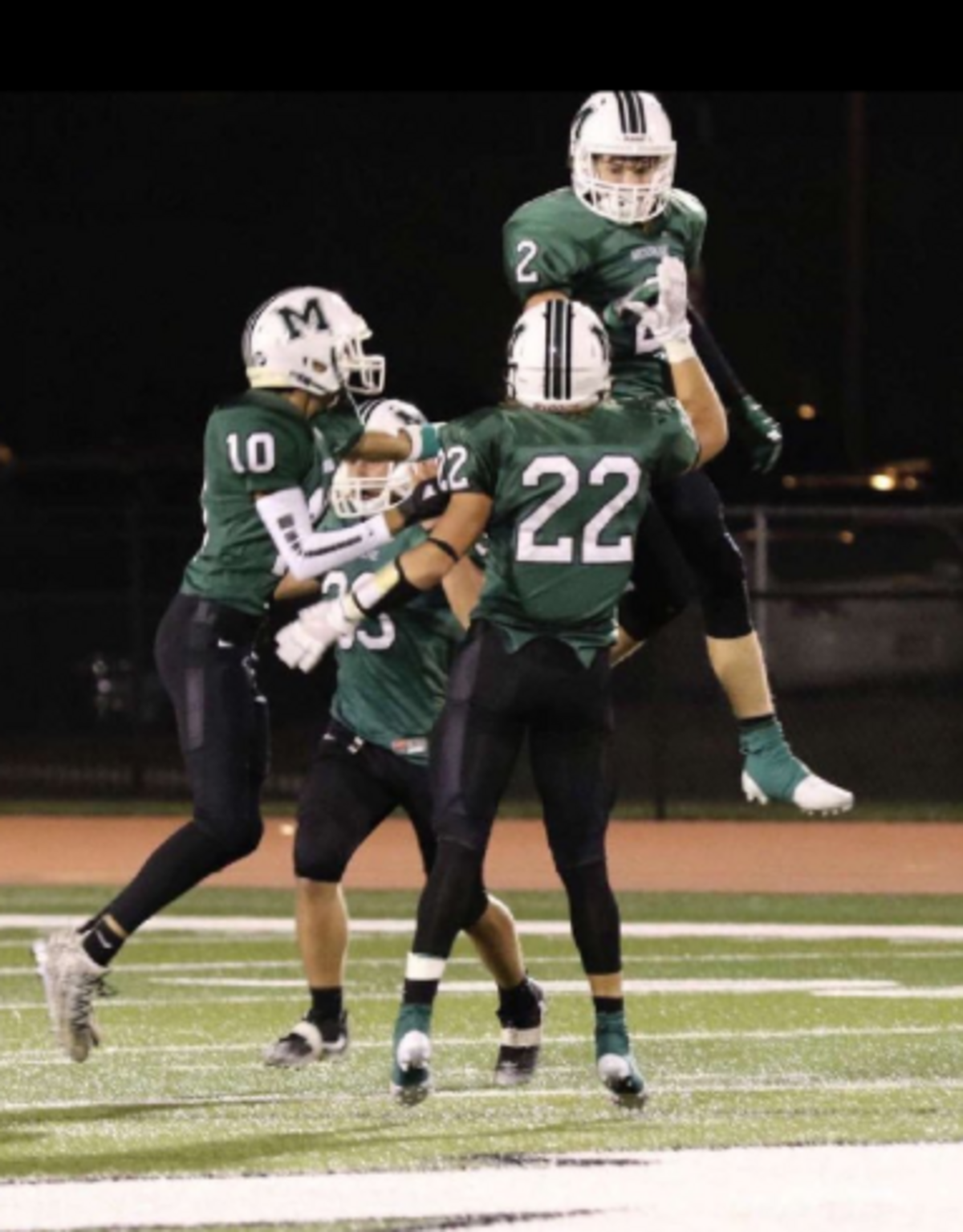 Mulvane’s Drew Ellis (2) celebrates with his teammates.