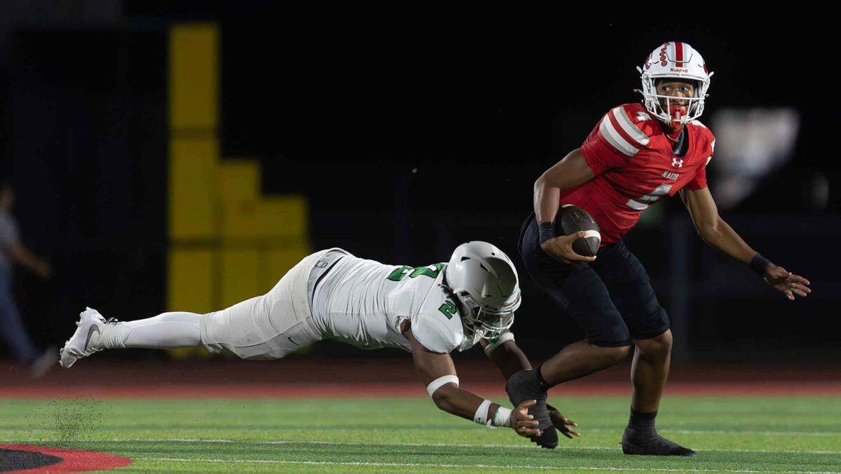 Maize senior quarterback Brayden Myovela escapes a would-be tackler from Derby in a 42-21 victory for the Eagles. Myovela scored five touchdowns in the game.