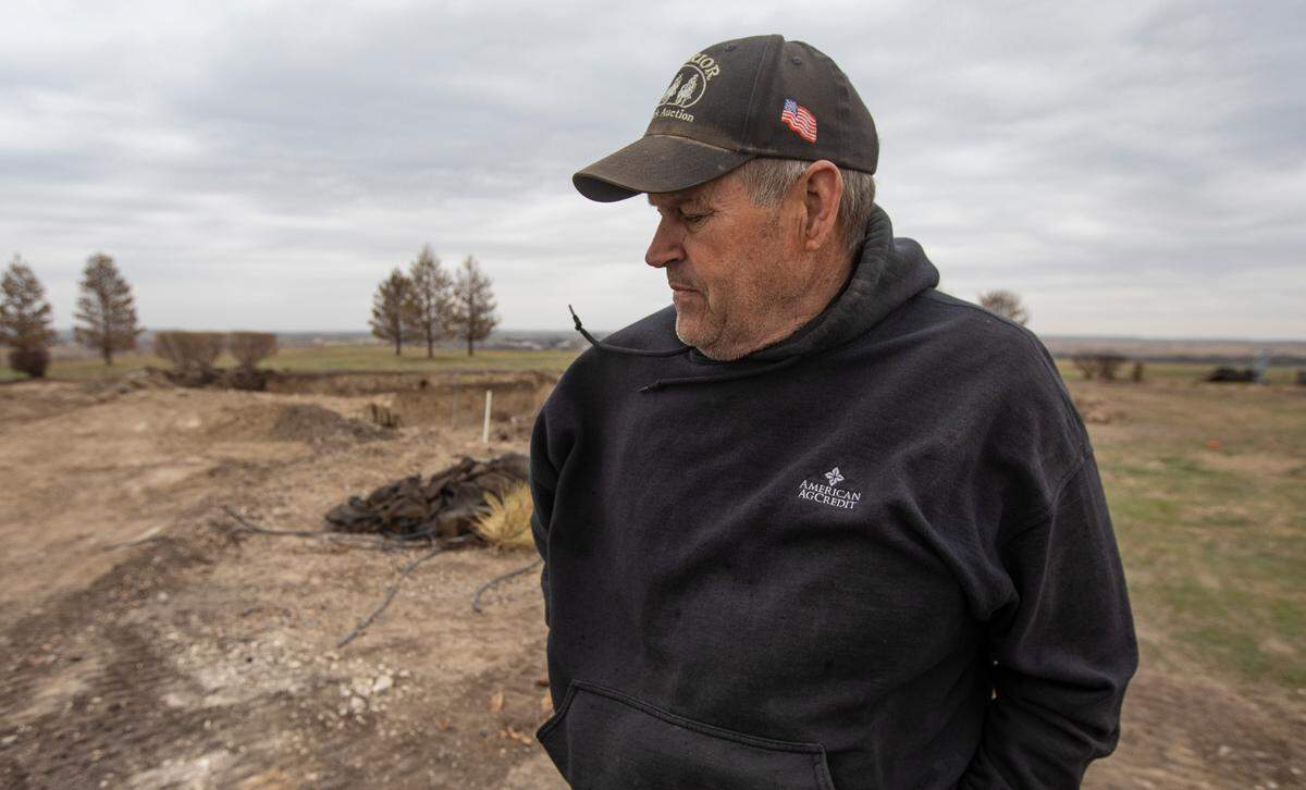 Chris Pelton stands on a hill where his family’s home once stood near Paradise, Kansas. Like many in the area, The Pelton family are still recovering from the Four-County fire that devastated the area in mid-December.