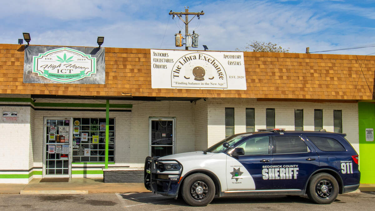 A Sedgwick County sheriff's car sits outside the 3108 W 13th St. N. High Hopes ICT storefront after law enforcement raided the dispensary, and five others like it, in Wichita in November 2025.