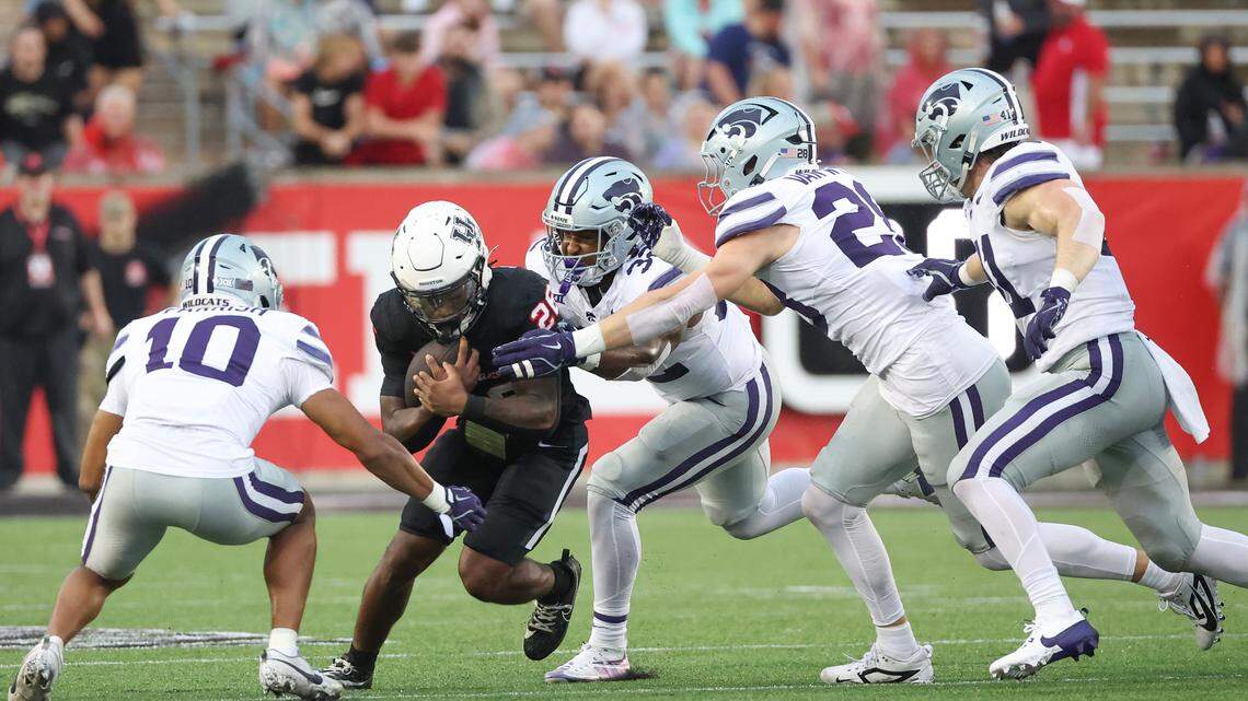 Houston Cougars running back Re’Shaun Sanford II (26) runs the ball against Kansas State Wildcats cornerback Jacob Parrish (10) and teammates in the first quarter at TDECU Stadium on Nov. 2, 2024.