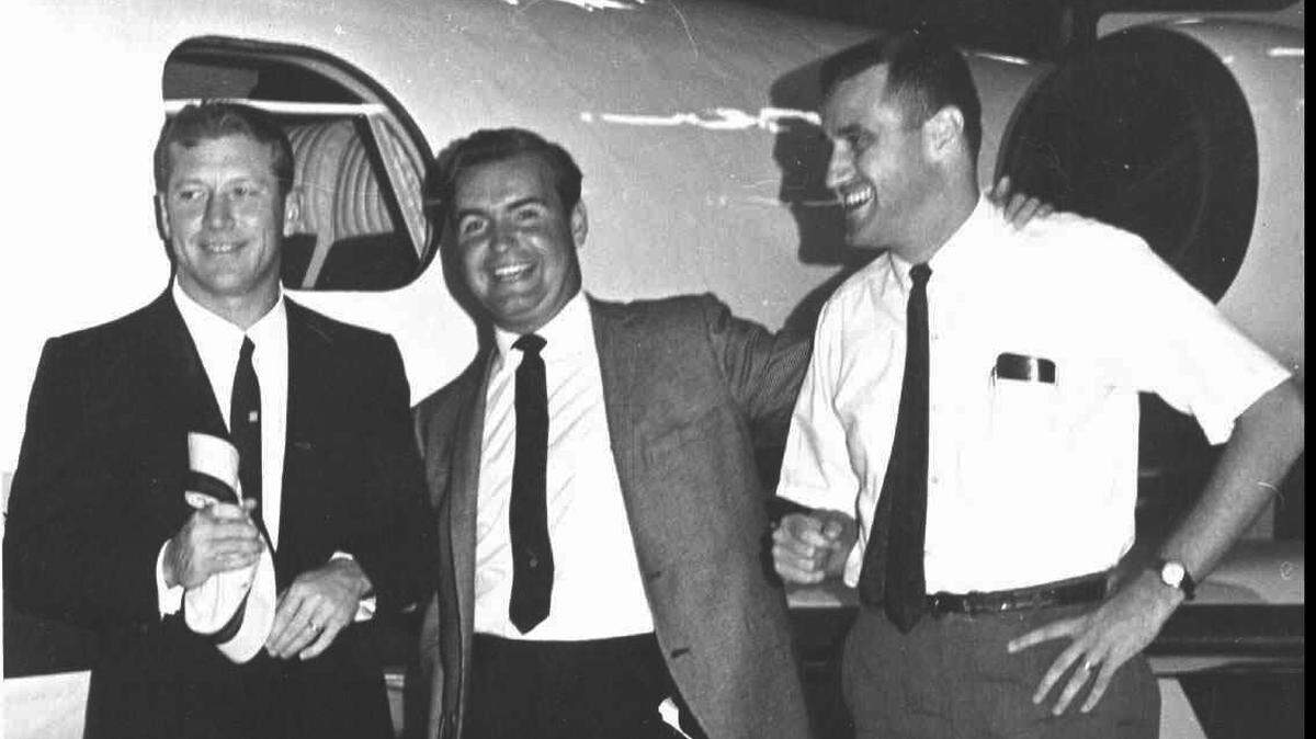 Al Higdon, right, with Mickey Mantle, left, and Tom Vickers in front of a Learjet.