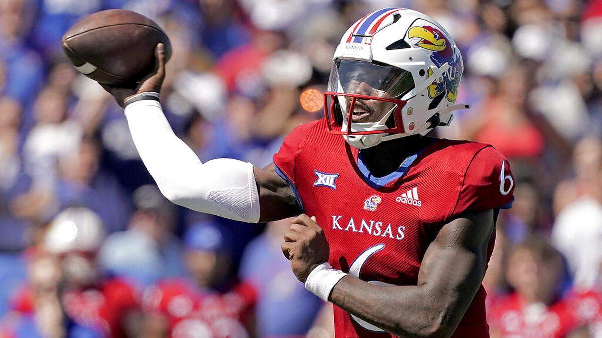 Kansas quarterback Jalon Daniels throws during the second half of an NCAA college football game against Duke Saturday, Sept. 24, 2022, in Lawrence, Kan. (AP Photo/Charlie Riedel)