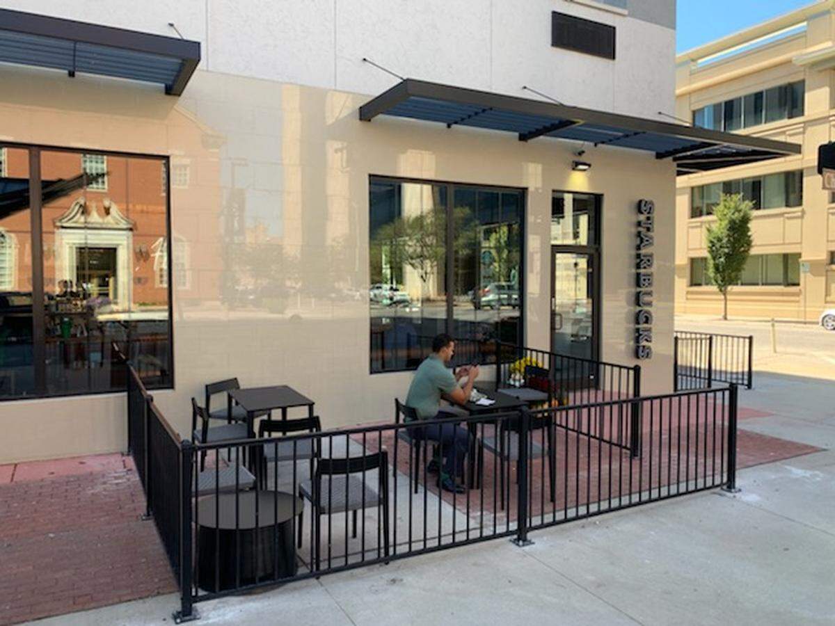 The new downtown Wichita Starbucks has two little patios: one facing Douglas and one facing Topeka.