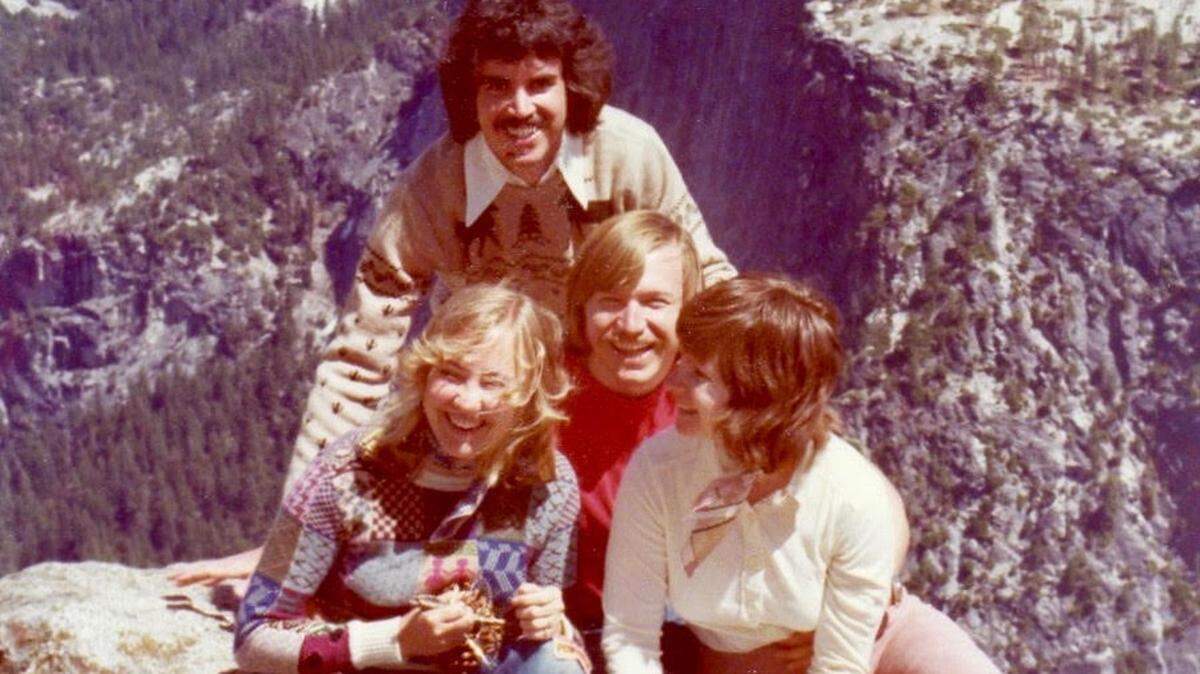 Joe Norris, back (or the one “with the Tony Orlando haircut,” as he puts it) and Mike Heine in Colorado in 1975 with their wives, Marilynn Norris, left, and Donna Heine. The men met as Sears catalog copywriters.