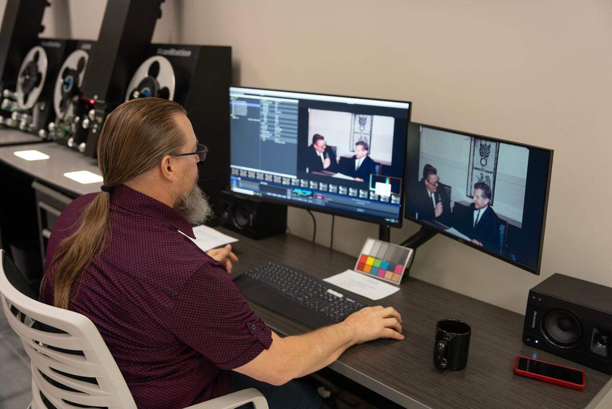 Dan Reisig, vice president of technology and innovation for Underground Vaults & Storage, scans a film at the company’s R3store Studios in Wichita.