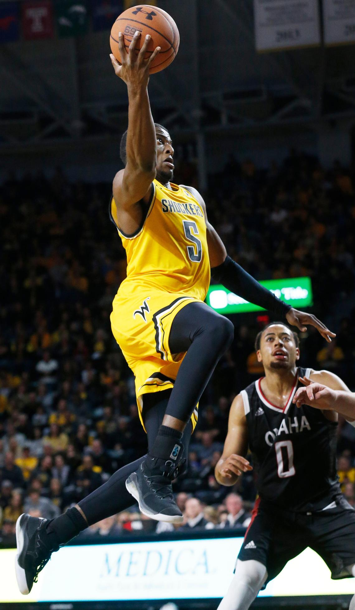 Wichita State forward Trey Wade (5) drives for the basket during the second half Tuesday night against Omaha in the Shockers season opener. (November 5, 2019)