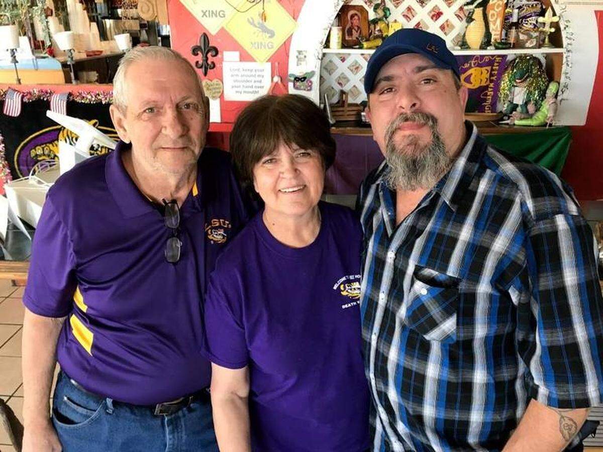 Chris Granger, left, is pictured in 2017 with his wife, Patty, and their son, Tim, who died in October.