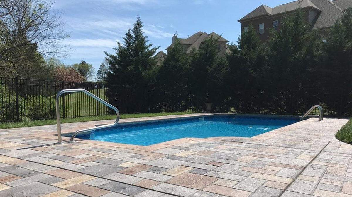 Sundek of Wichita took an older concrete patio with a lot of cracks and transformed it into a new pool patio with a tile look.