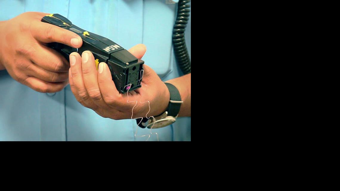 A Sedgwick County sheriff’s deputy shows one of the department’s Tasers.

