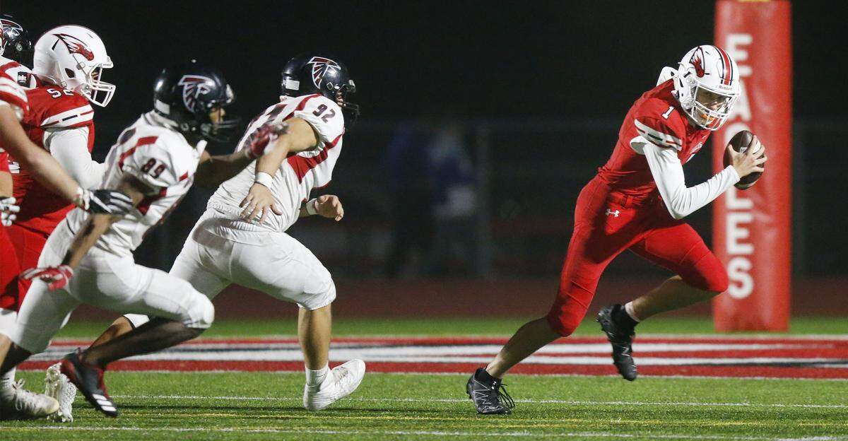 Maize QB Caleb Grill scrambles against Heights in the second quarter during the second round of the 5A playoff at Maize High Friday. (Nov. 3, 2017)