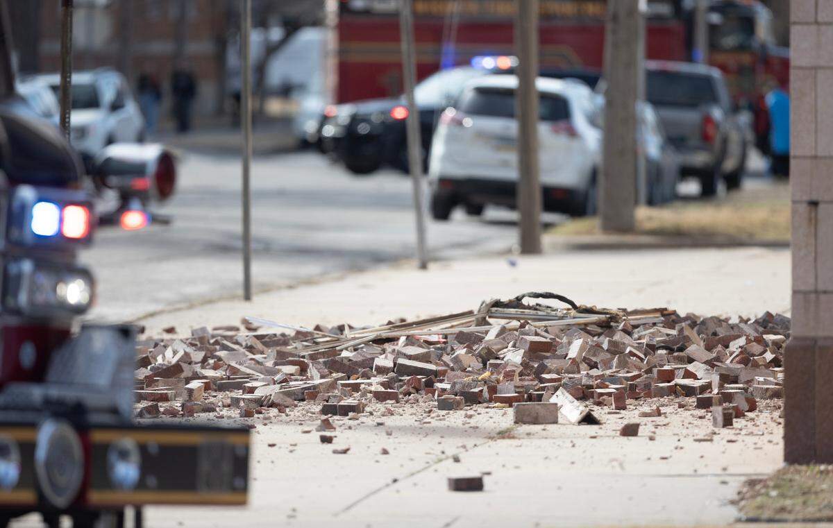 A large section of bricks collapsed off the south face of the Commodore building on north Broadway Wednesday. No one was injured.
